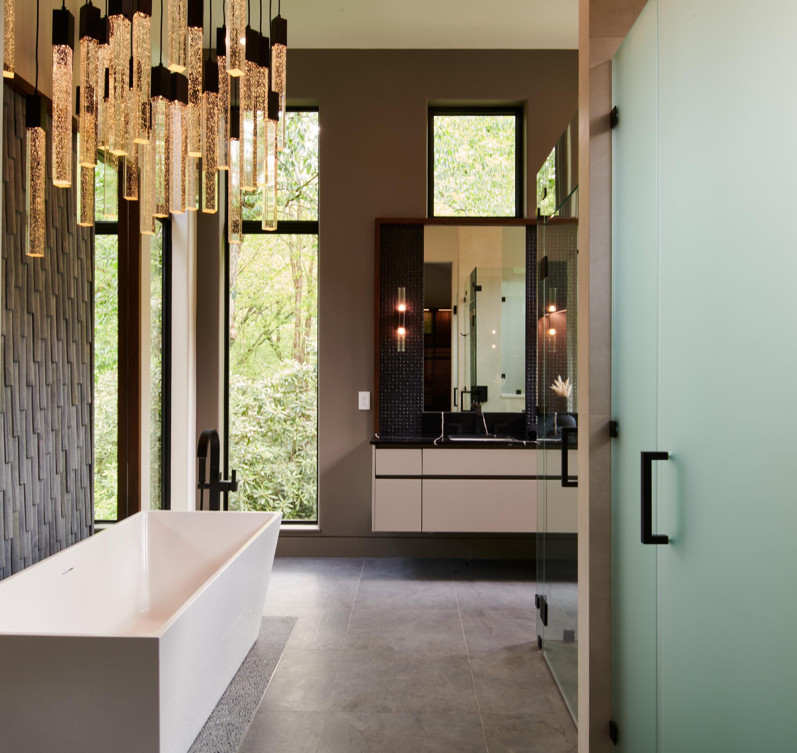 a_bathroom_with_a_bathtub_and_a_mirror_brdb_highlands_nc_master_bathroom_