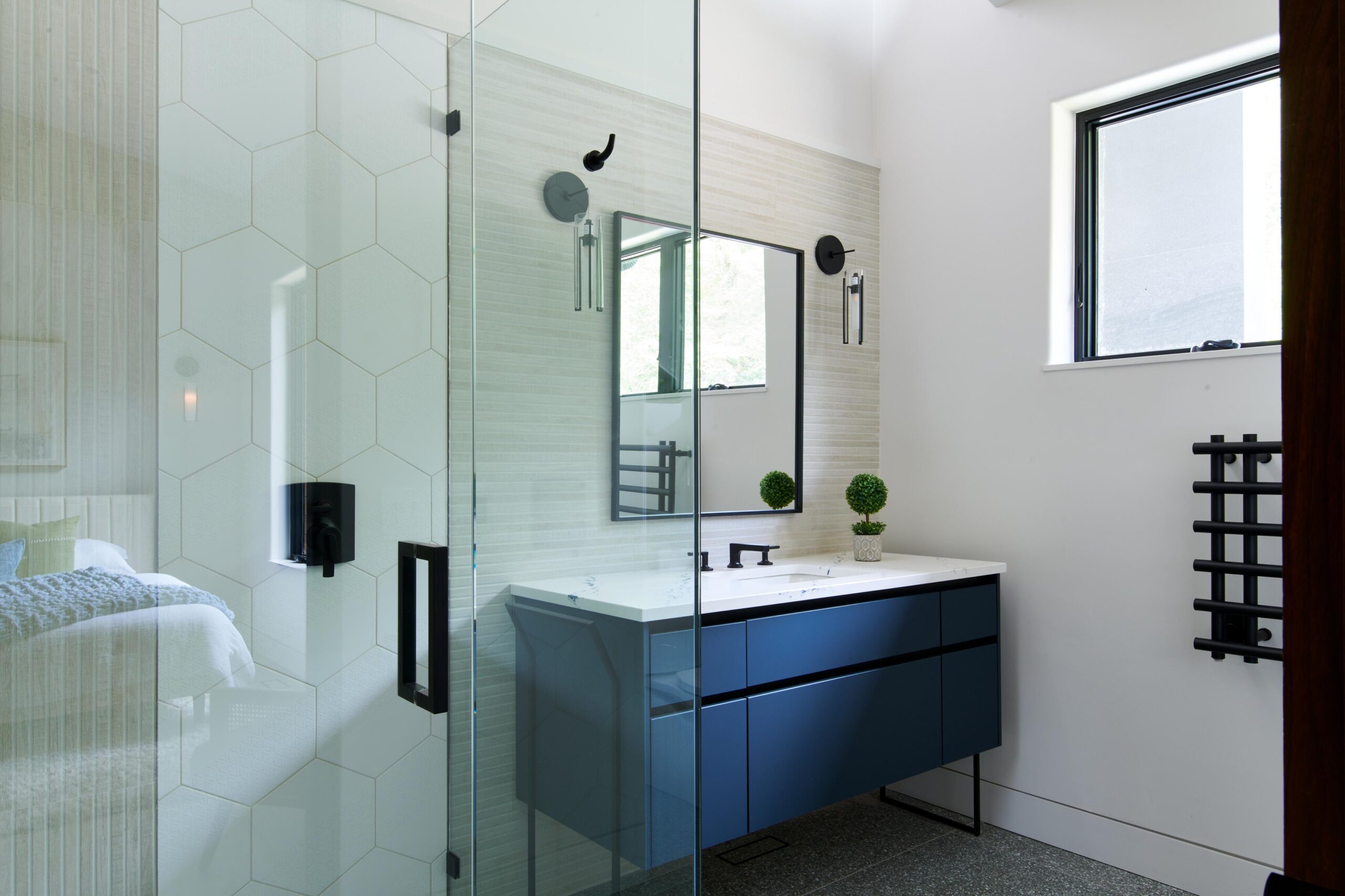 a_bathroom_with_a_sink_and_a_mirror_brdb_highlands_nc_guest_bath_