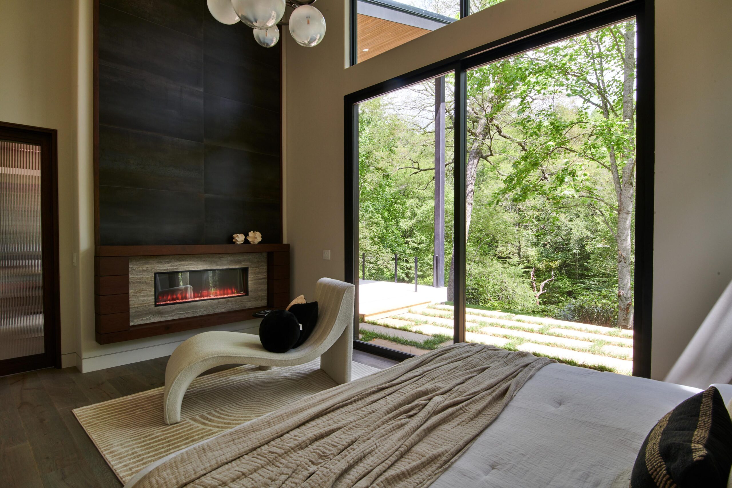 a_bedroom_with_a_fireplace_and_a_bed_brdb_highlands_nc_bedroom_