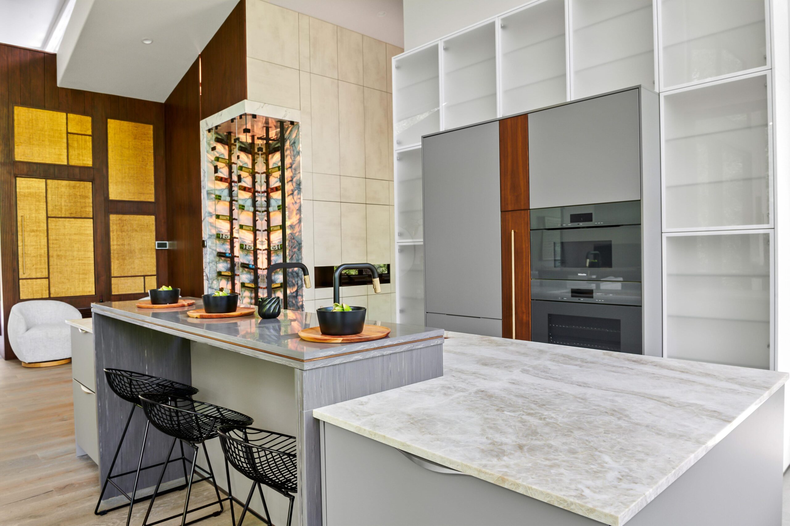 a kitchen with a marble island brdb highlands nc kitchen natural light 1 scaled