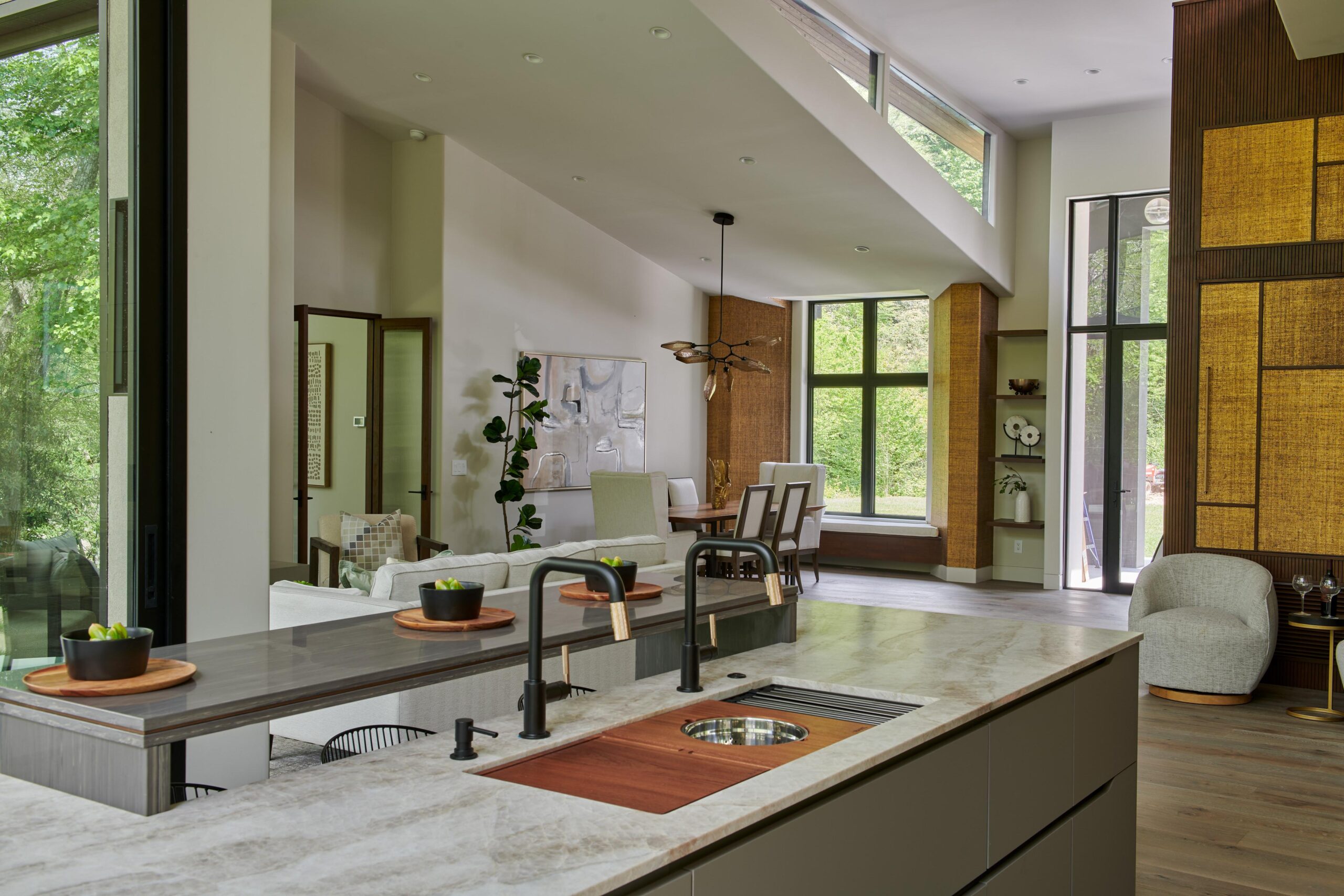 a_kitchen_with_a_sink_and_a_window_brdb_highlands_nc_kitchen_natural_light