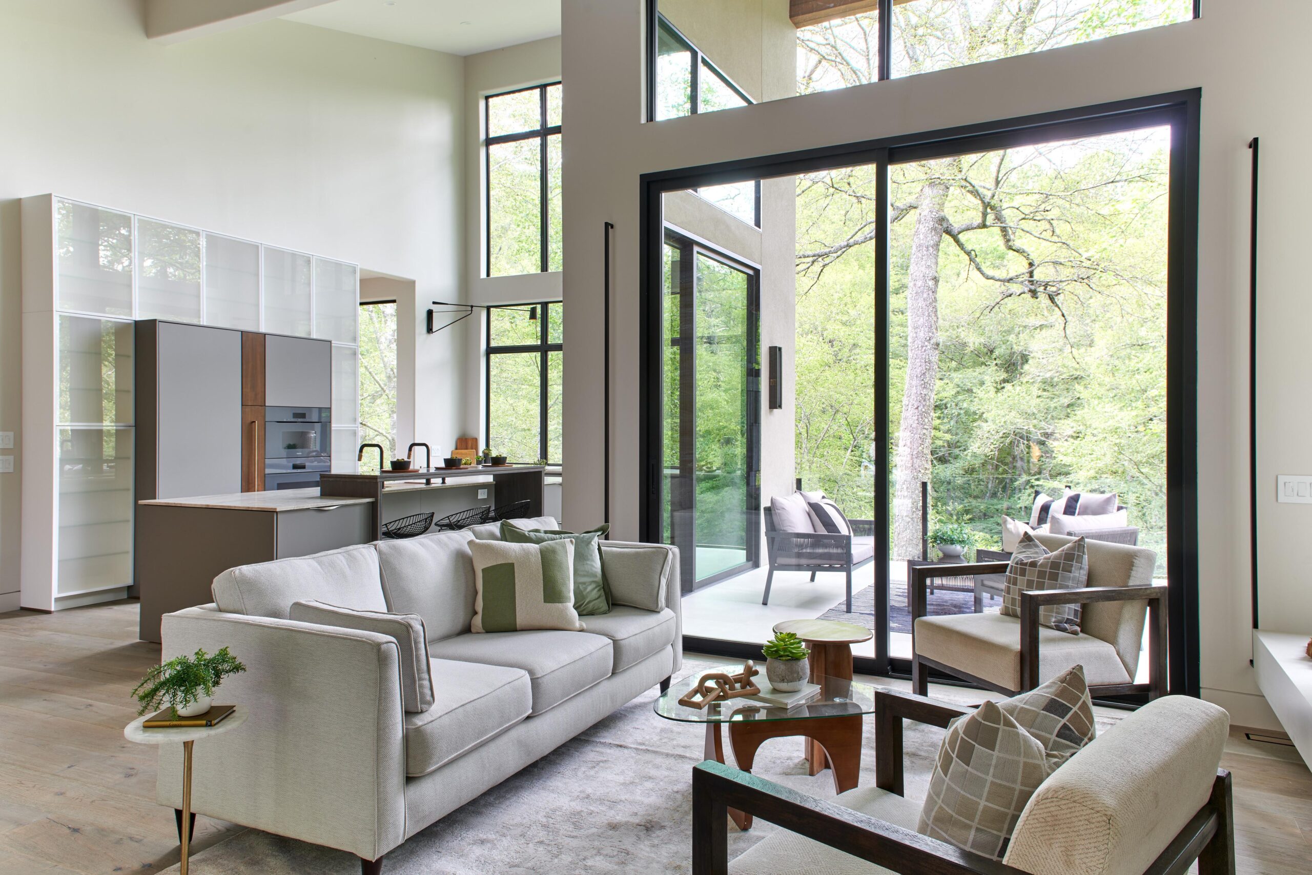 a_living_room_with_a_couch_and_a_table_brdb_highlands_nc_kitchen-living_room_natural_light
