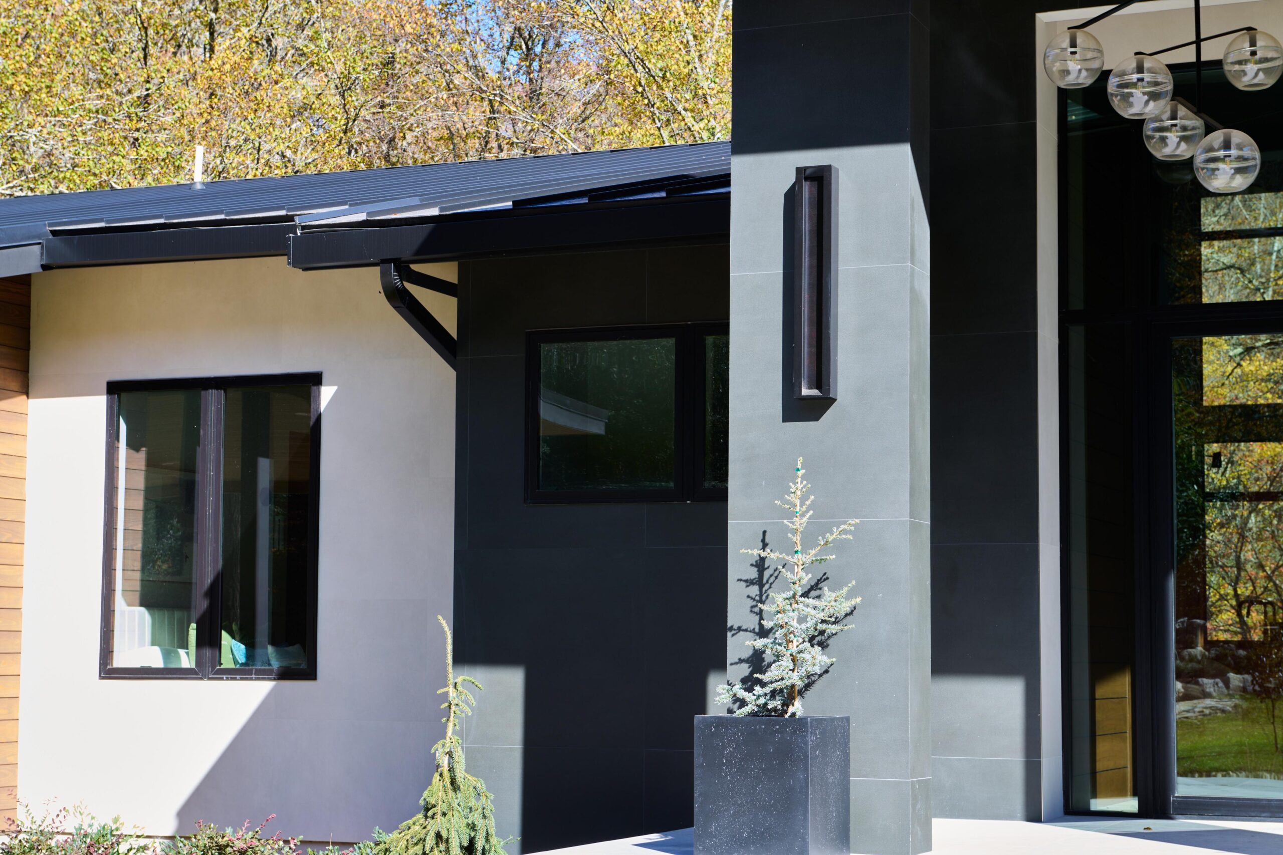 a_modern_house_with_a_wood_roof_and_metal_railing_brdb_highlands_nc_exterior-details_natural_light