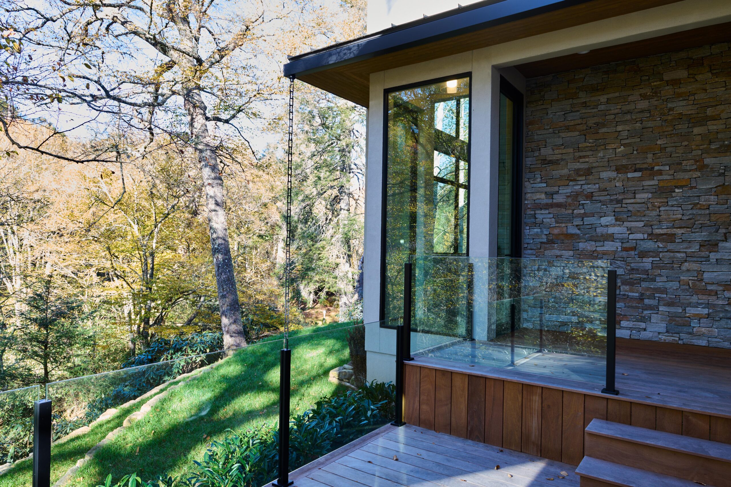 a_house_with_a_lot_of_windows_and_a_lot_of_grass_brdb_highlands_nc_natural_light